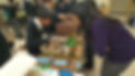 Student showing their project to teacher